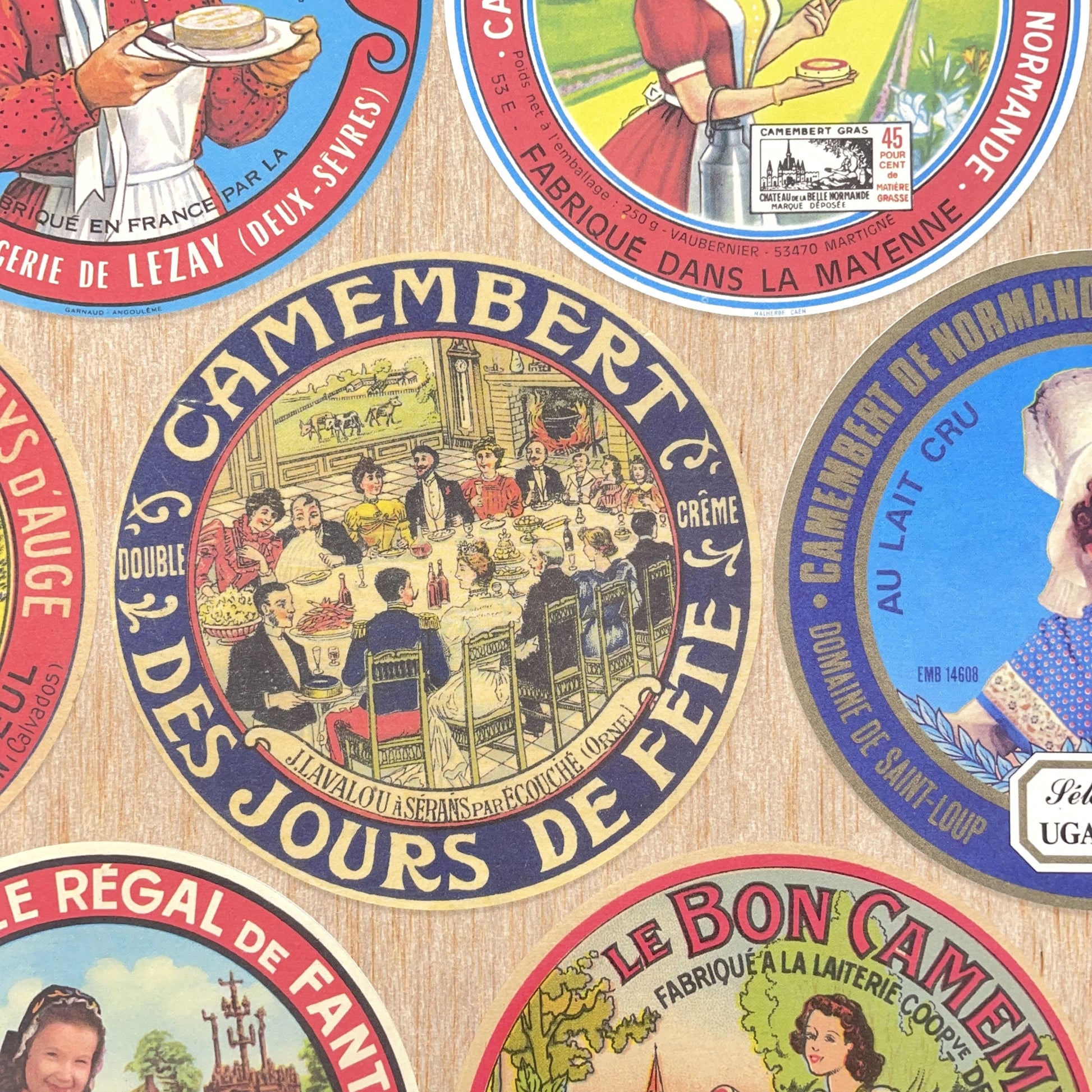 Poster wrap by The Pattern Book.  this sheet of wrapping paper is covered with images of vintage camembert cheese wrappers.  Detail image showing a couple of the labels