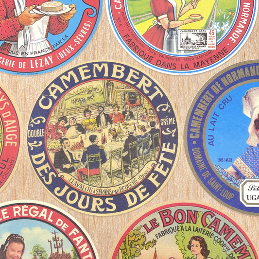 Poster wrap by The Pattern Book.  this sheet of wrapping paper is covered with images of vintage camembert cheese wrappers.  Detail image showing a couple of the labels