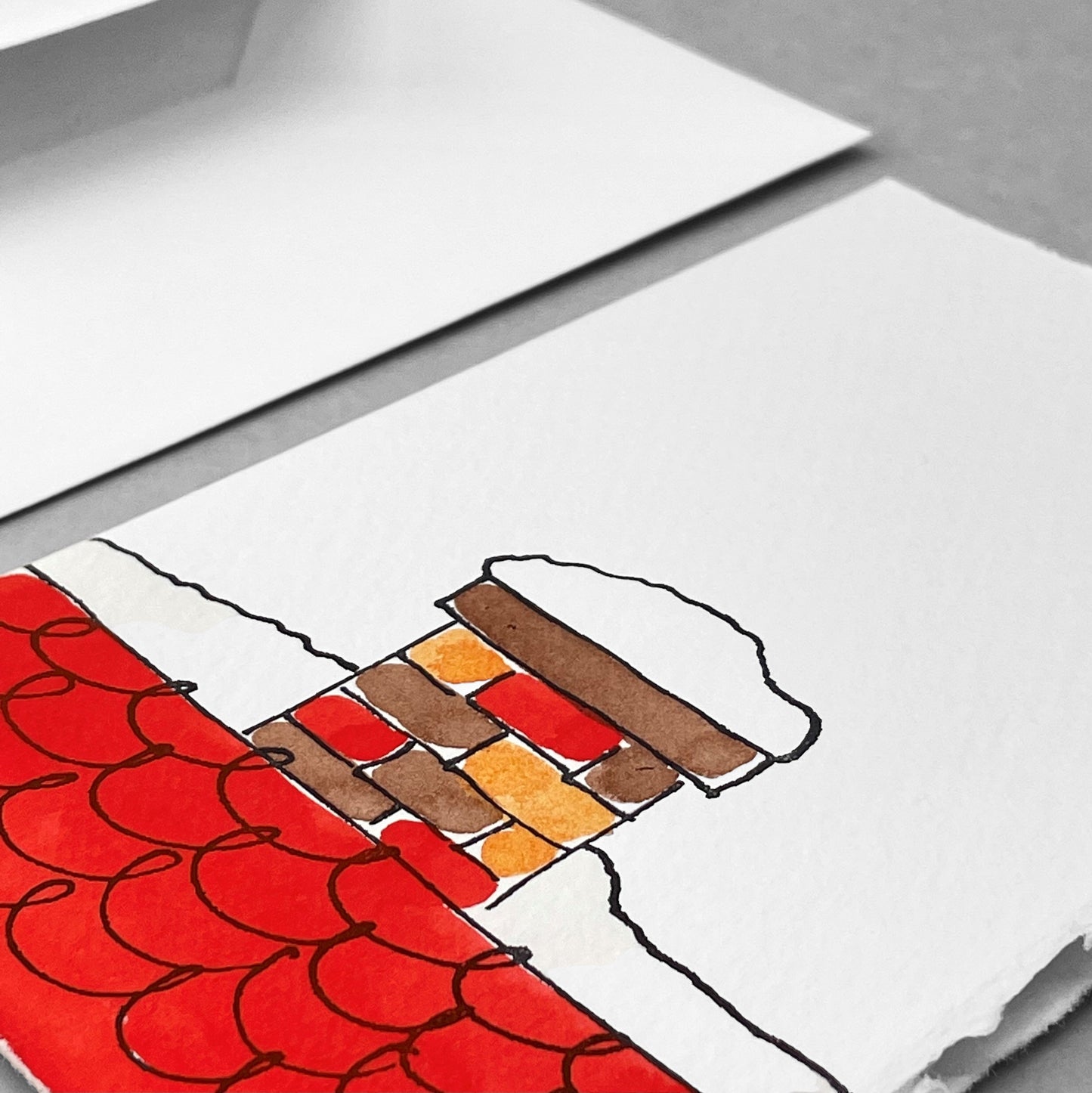 hand-painted greetings card of a red chimney in the snow by Scribble and Daub