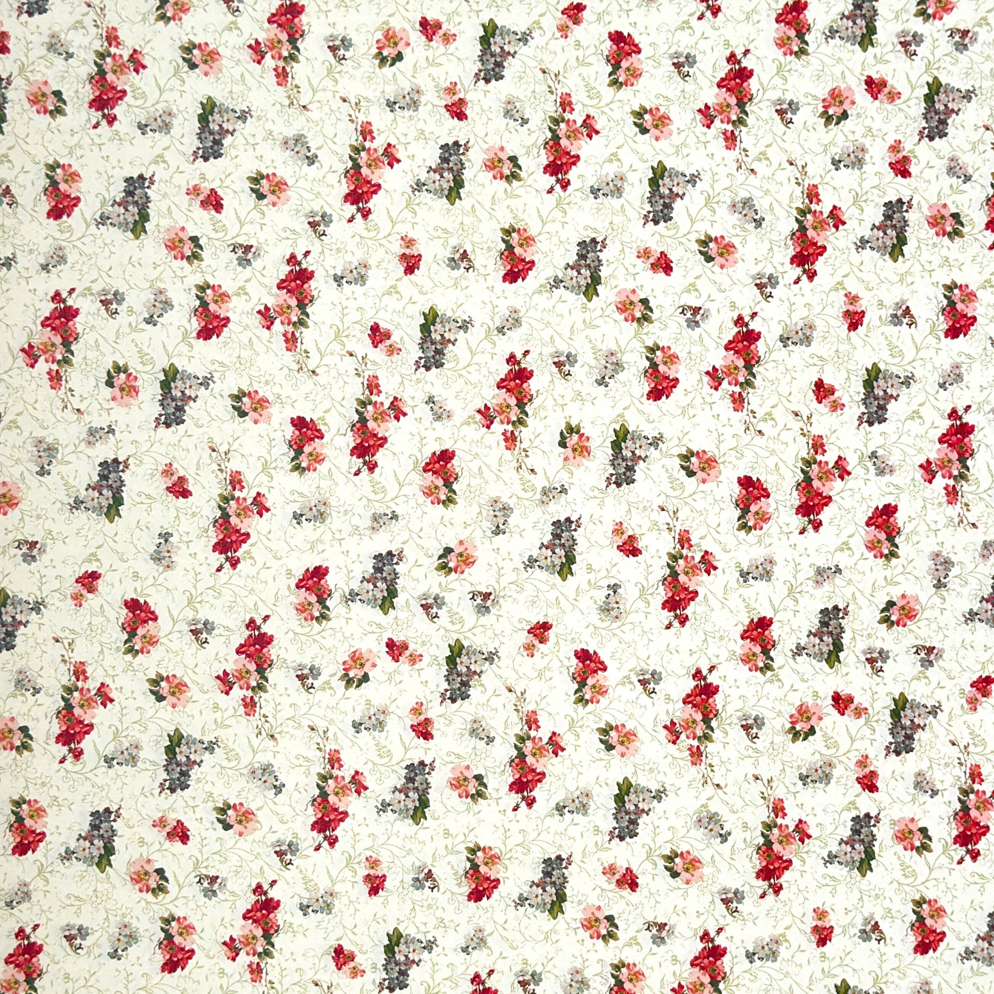 a sheet of italian wrapping paper with a vintage Liberty style floral pattern in red and green on cream
