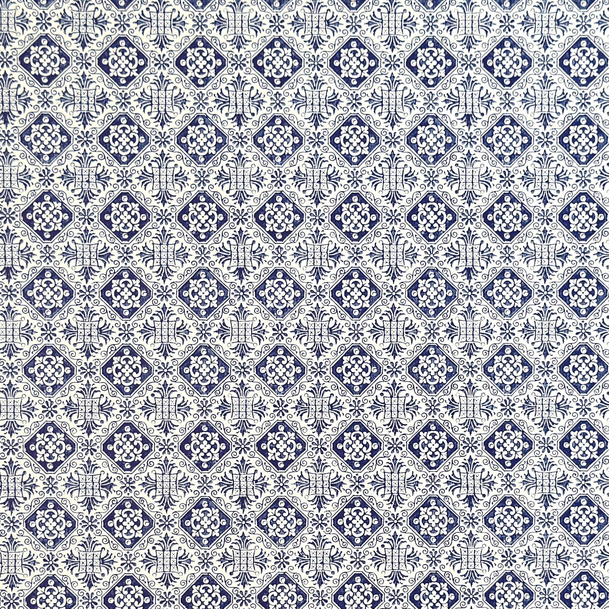 a sheet of italian wrapping paper with a blue block print repeat stamp pattern on white.
