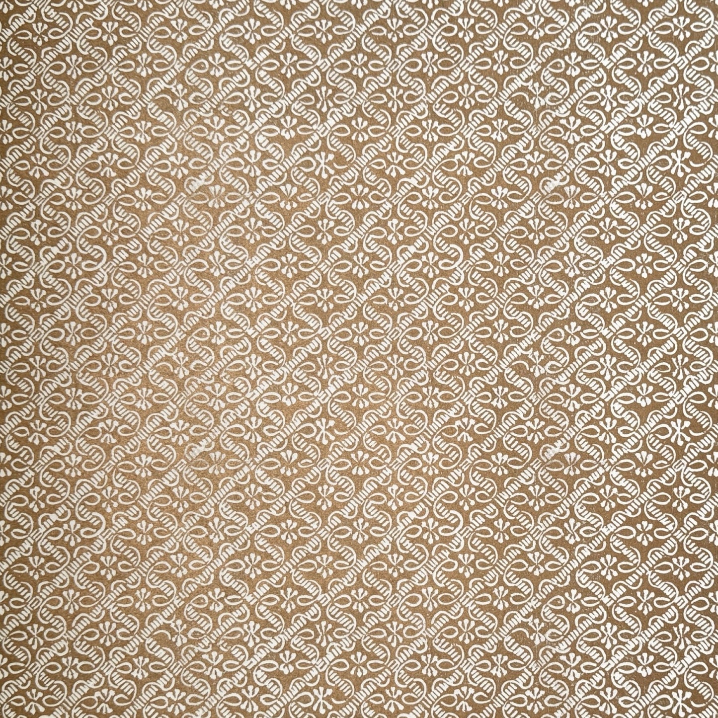 a sheet of italian wrapping paper with a decorative diamond grid in bronze gold on white