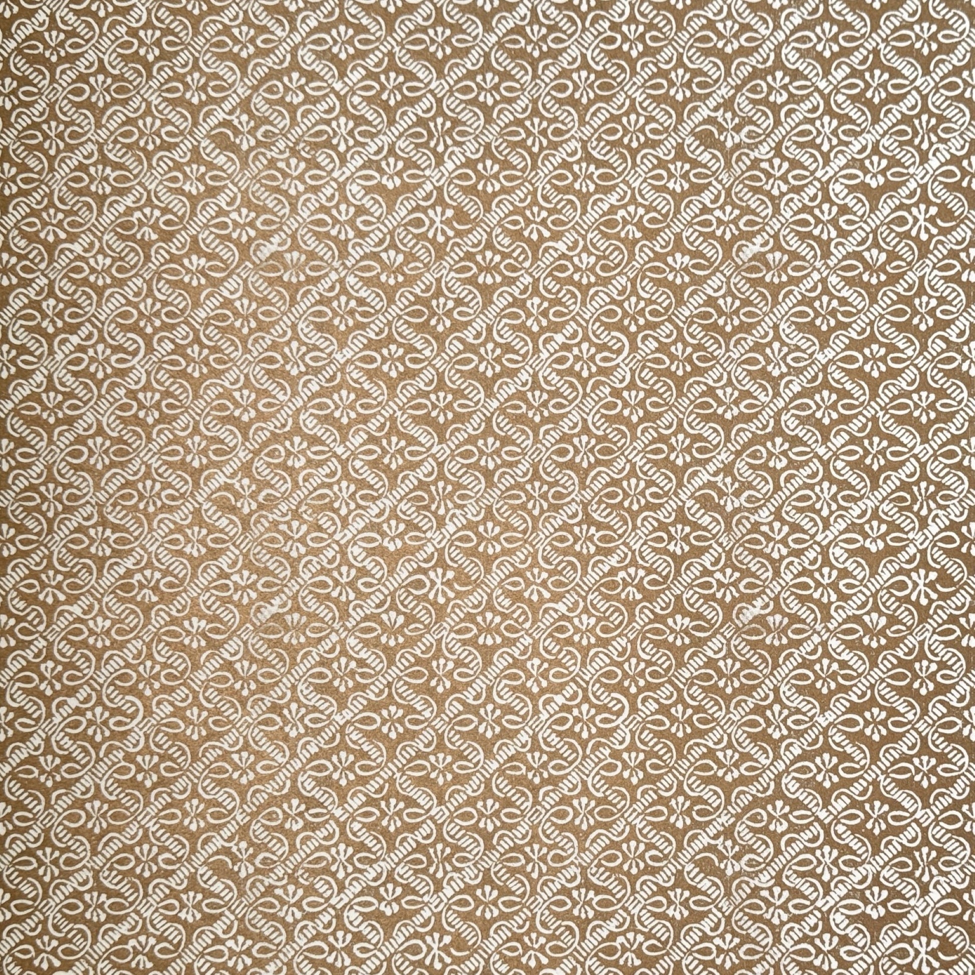 a sheet of italian wrapping paper with a decorative diamond grid in bronze gold on white