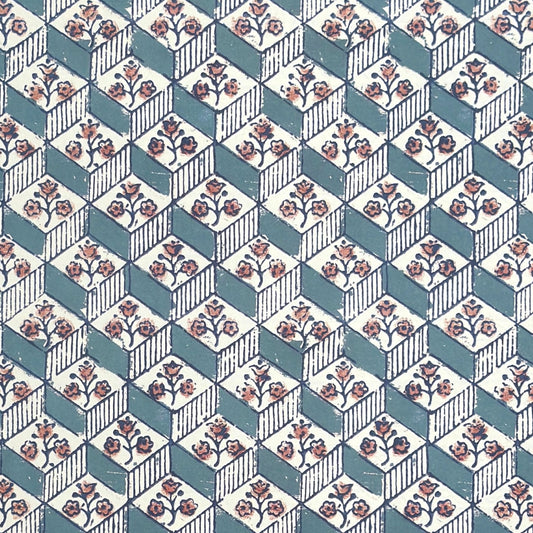 italian remondini florentine wrapping paper with a geometric rombi pattern in blue with a block print flower in pink on a white background