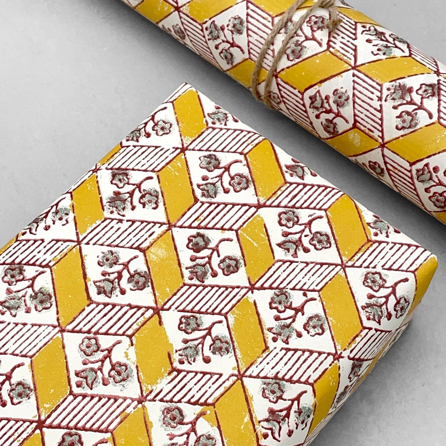 italian Remondini patterned wrapping paper by Tassotti.  Block printed rhombus pattern with little flowers in yellow, white and green