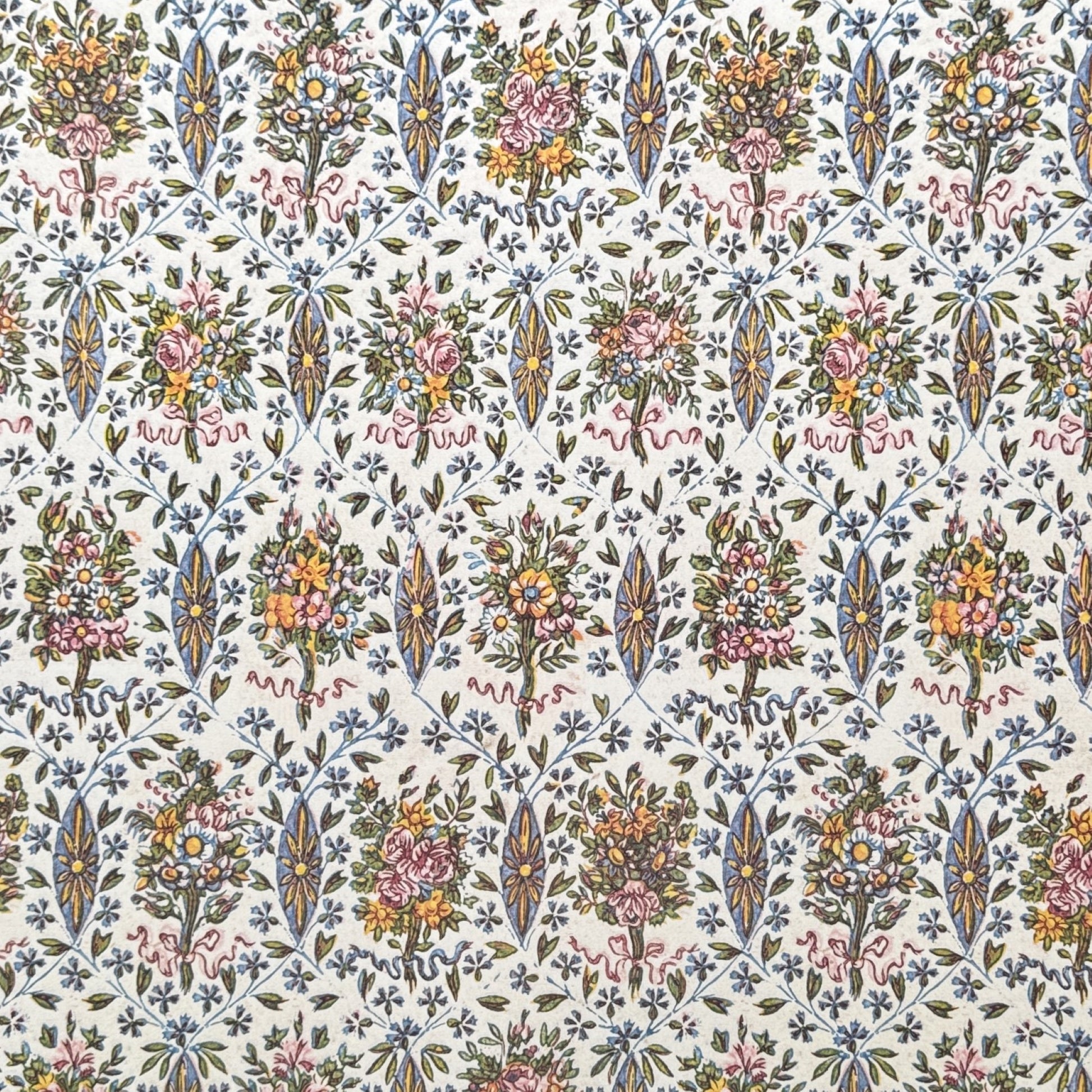 a sheet of italian wrapping paper with a mutlicoloured floral pattern on white