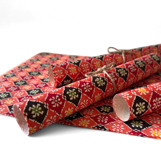 vintage katazome-shi stencil-dyed small papers from Japan. Japanese check pattern in coral pink, red and burgundy. Pictured rolled.