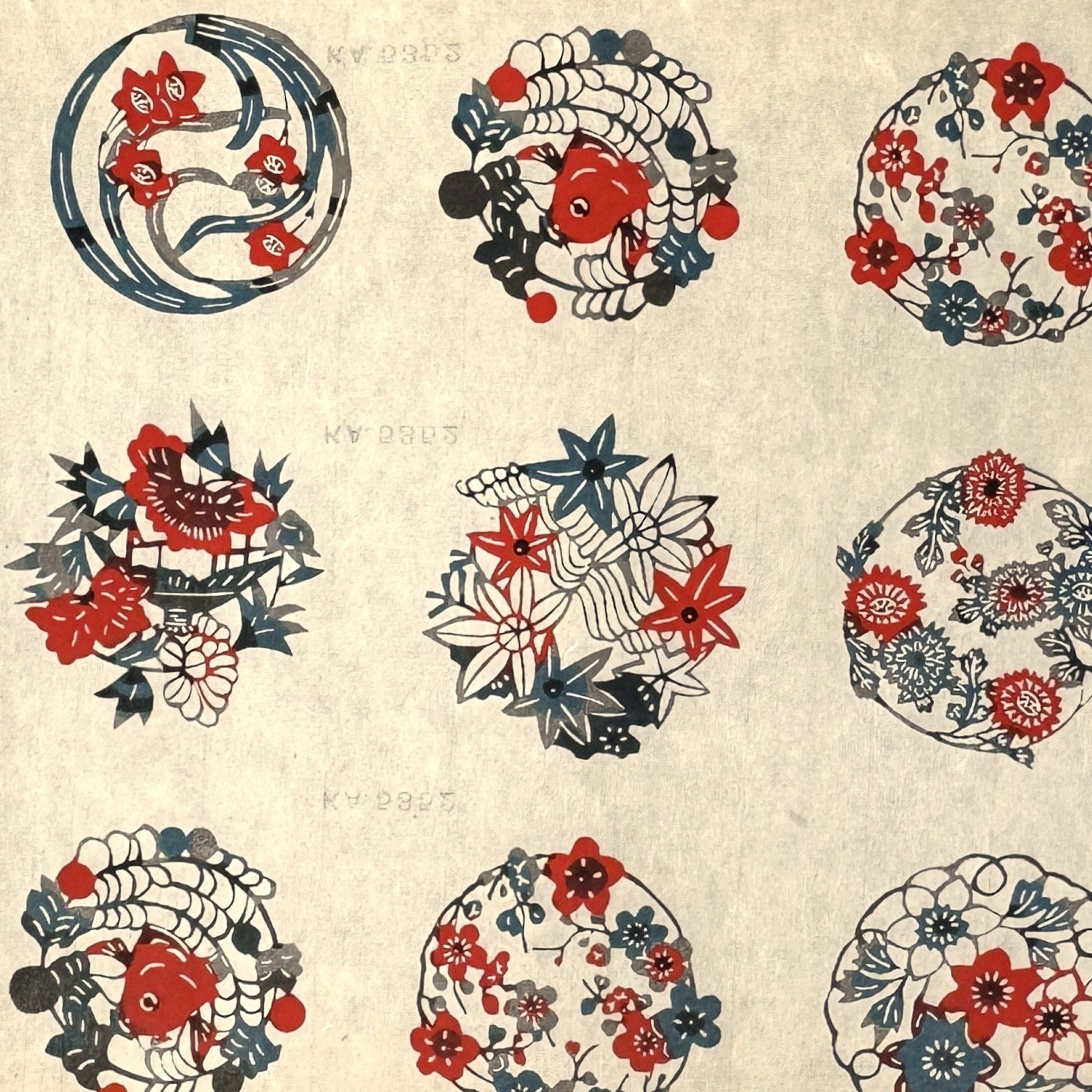 vintage katazome-shi stencil-dyed small papers from Japan. Cream paper with Japanese circle motifs in red, blue and green.
