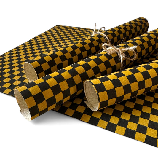 vintage katazome-shi stencil-dyed small papers from Japan. Check pattern in gold and black. Pictured rolled.