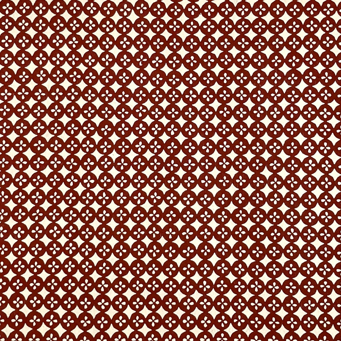 vintage katazome-shi stencil-dyed small papers from Japan. Cream paper with terracotta circles pattern.