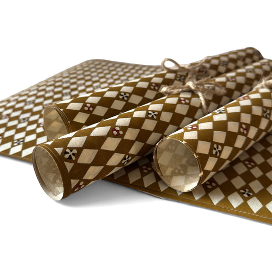 vintage katazome-shi stencil-dyed small papers from Japan. Cream paper with brown diamond pattern. Pictured rolled.