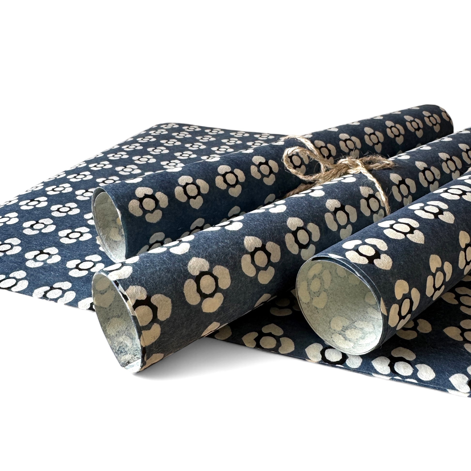 vintage katazome stencil dyed paper. azure blue paper with cream flower motifs. Pictured rolled
