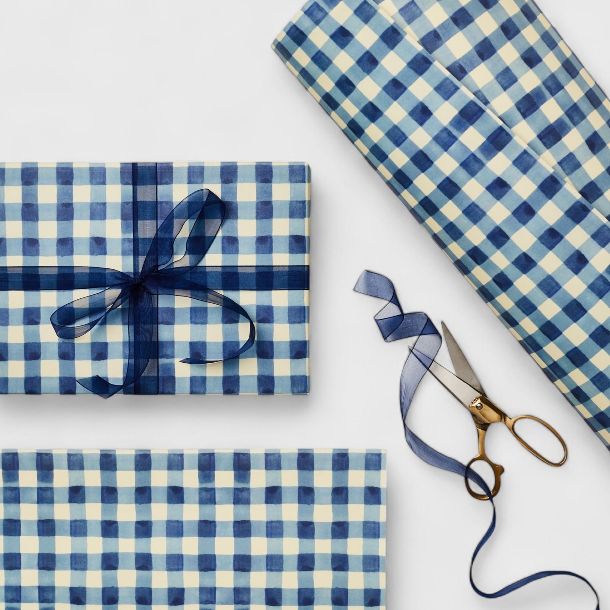 blue and white gingham patterned wrapping paper by Wanderlust. Shown wrapped