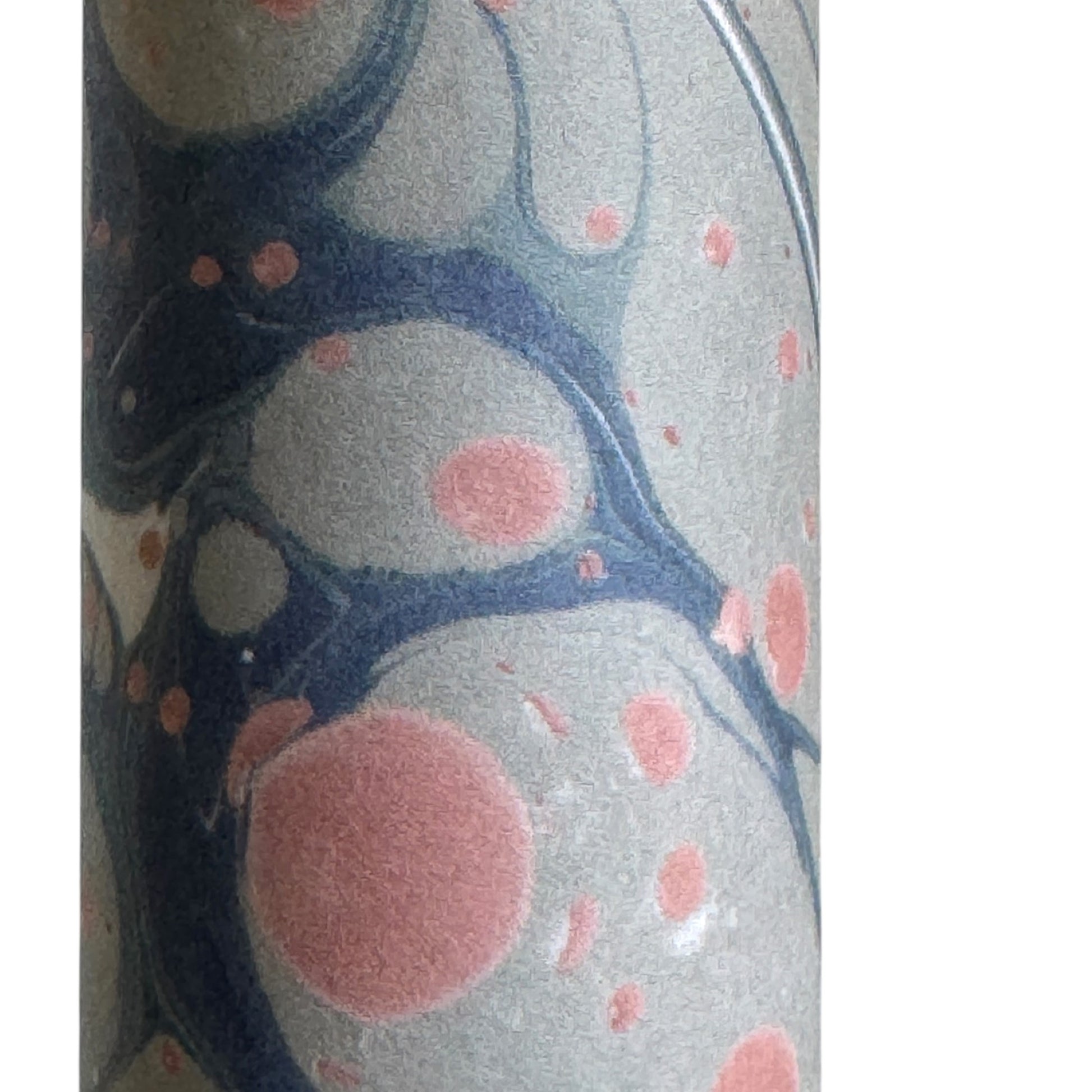 Printed marbled wrapping paper in dusty blue, grey and pink. Close up