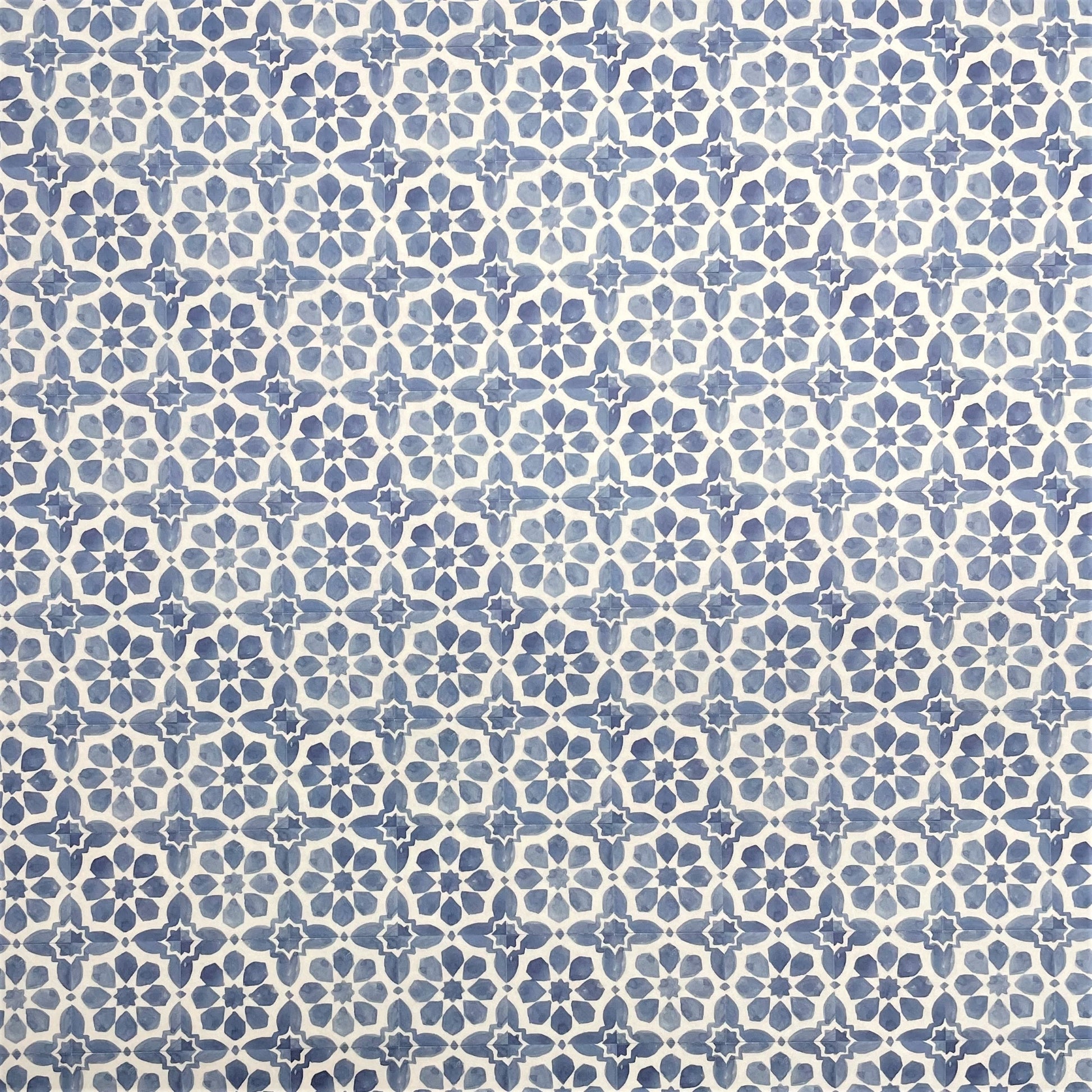 patterned paper / gift wrap with a blue and white tile design. By Wanderlust