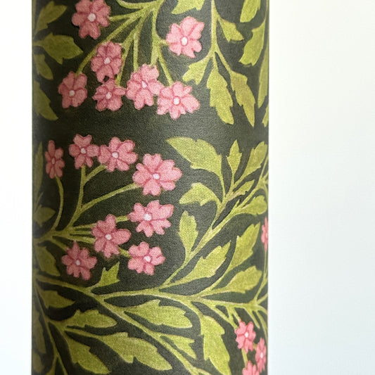 floral patterned wrapping paper in green and pink. Close-up