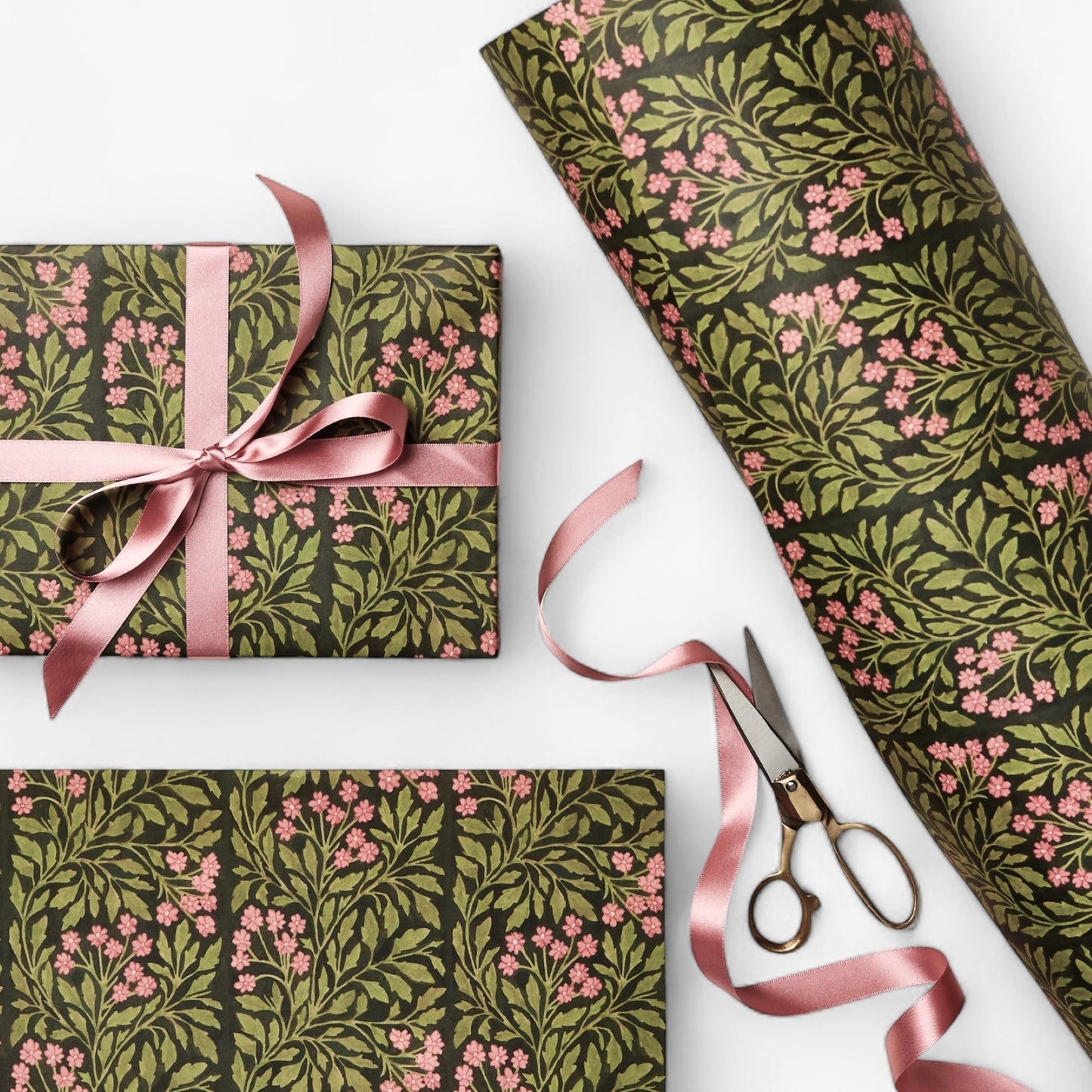 floral patterned wrapping paper in green and pink. pictured wrapped