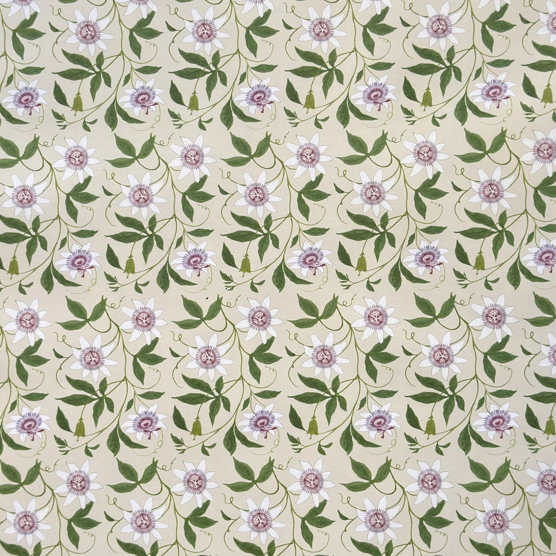 floral wrapping paper with pink passion flowers, green leaves on a cream background
