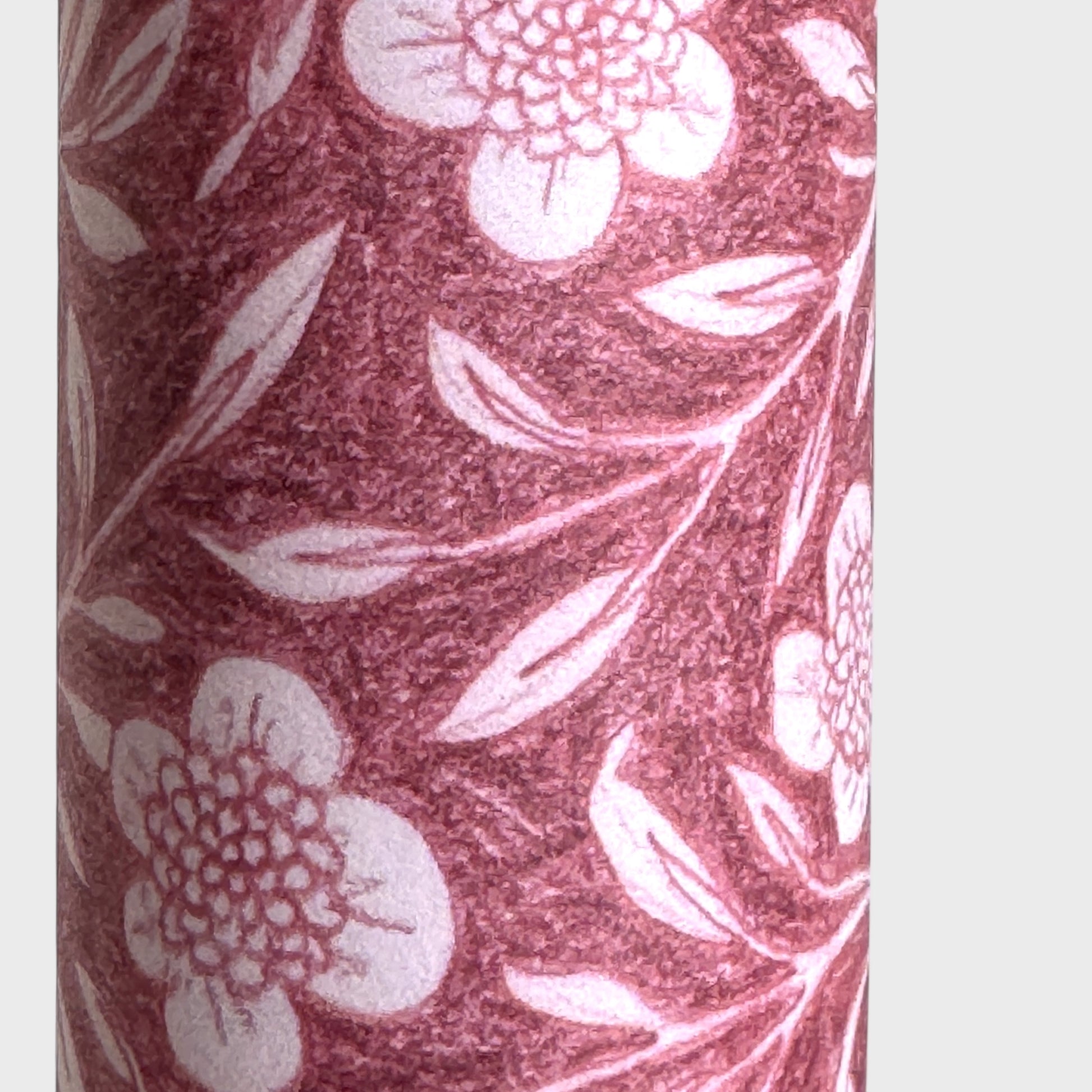 patterned paper / gift wrap with a delicate floral pattern in deep pink and white by Wanderlust. Close up