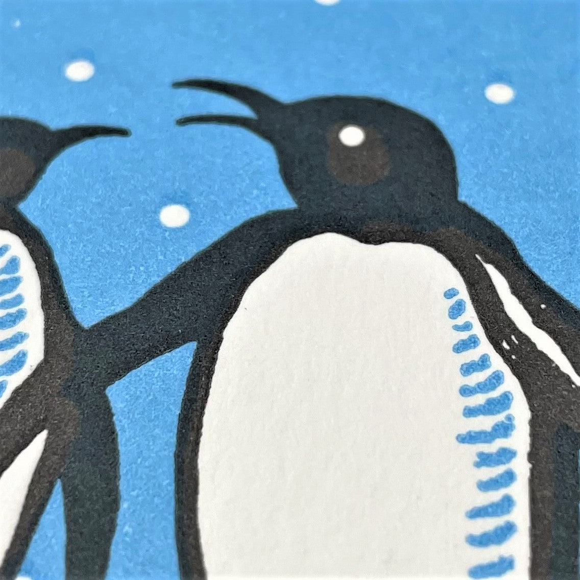 small greetings card with penguin design, close up of the card