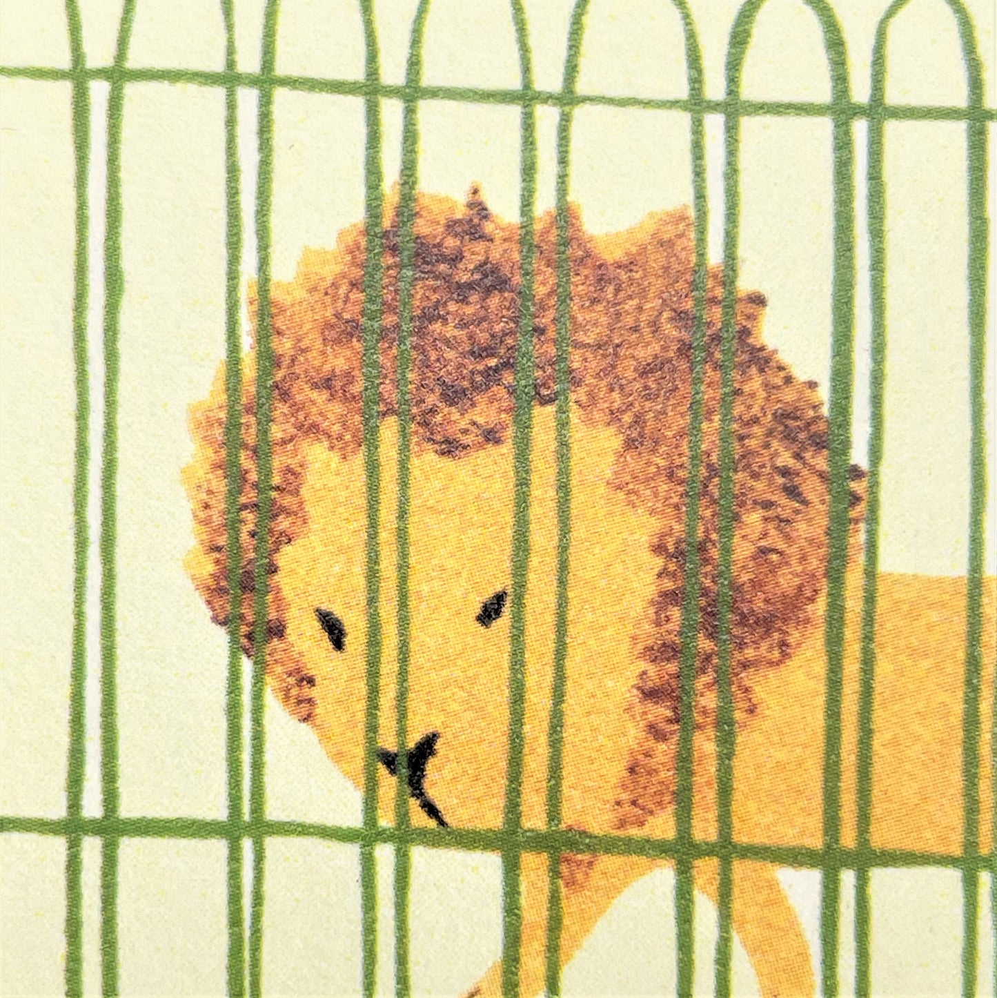 greetings card showing a drawing of a women in a red coat walking young children though a zoo with a lion and a giraffe, close up of the lion