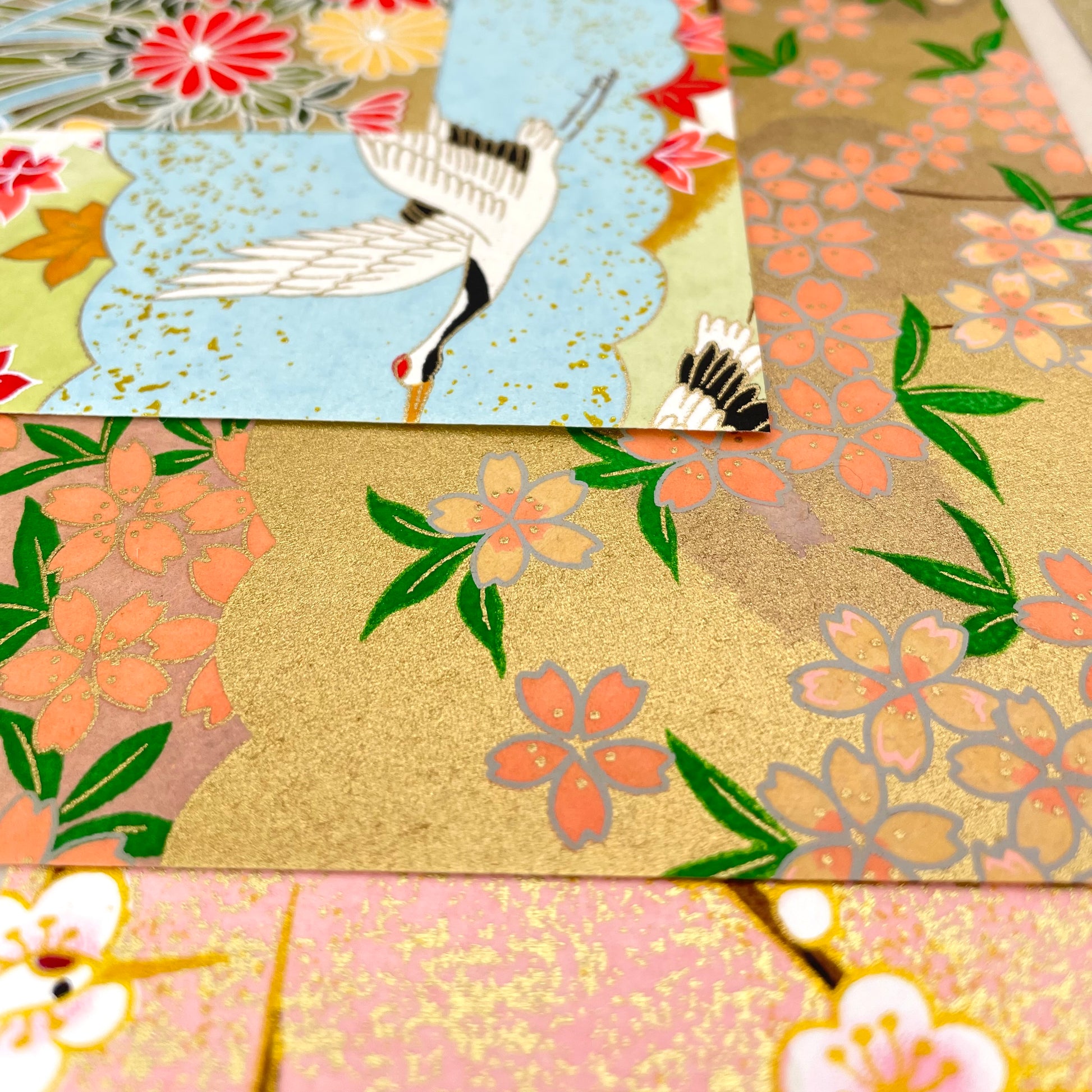 pack of silkscreen origami patterned papers, close up of the paper designs