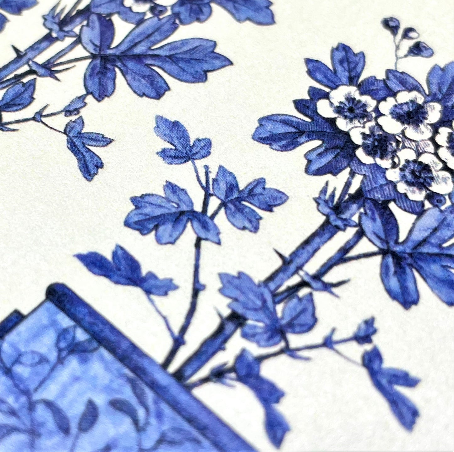 greetings card showing three blue flower pots with a bird in each., close up of the flowers