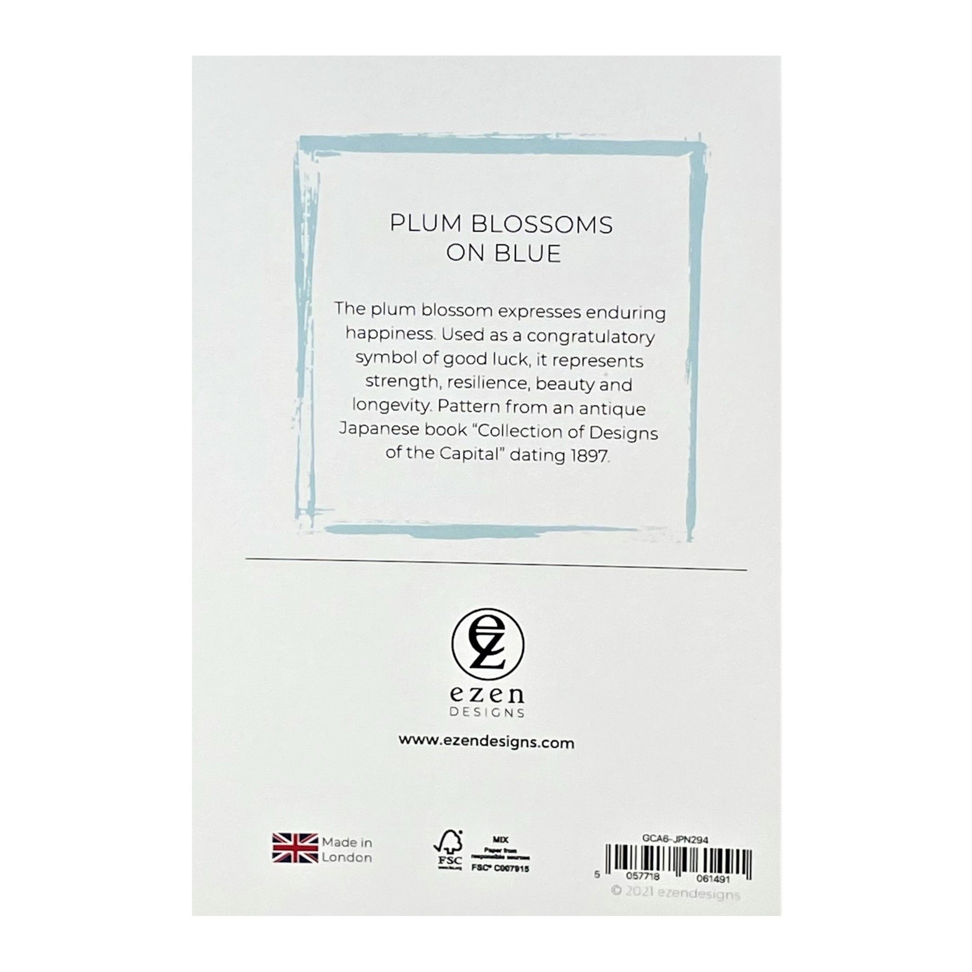 greetings card with a repeat pattern of plum blossom on pale blue backdrop, reverse of card showing text