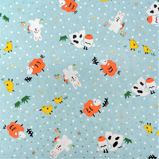 japanese silk-screen handmade paper showing spring animals motifs on a light blue backdrop