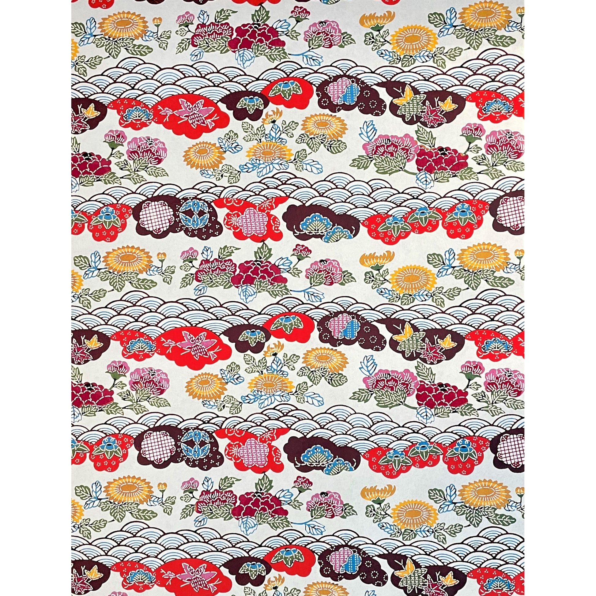 japanese stencil-dyed handmade paper with traditional botanical pattern in red, brown, yellow and blue, full sheet view