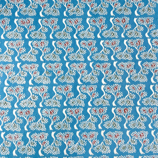 japanese stencil-dyed handmade paper with bonsai tree repeat pattern on blue backdrop