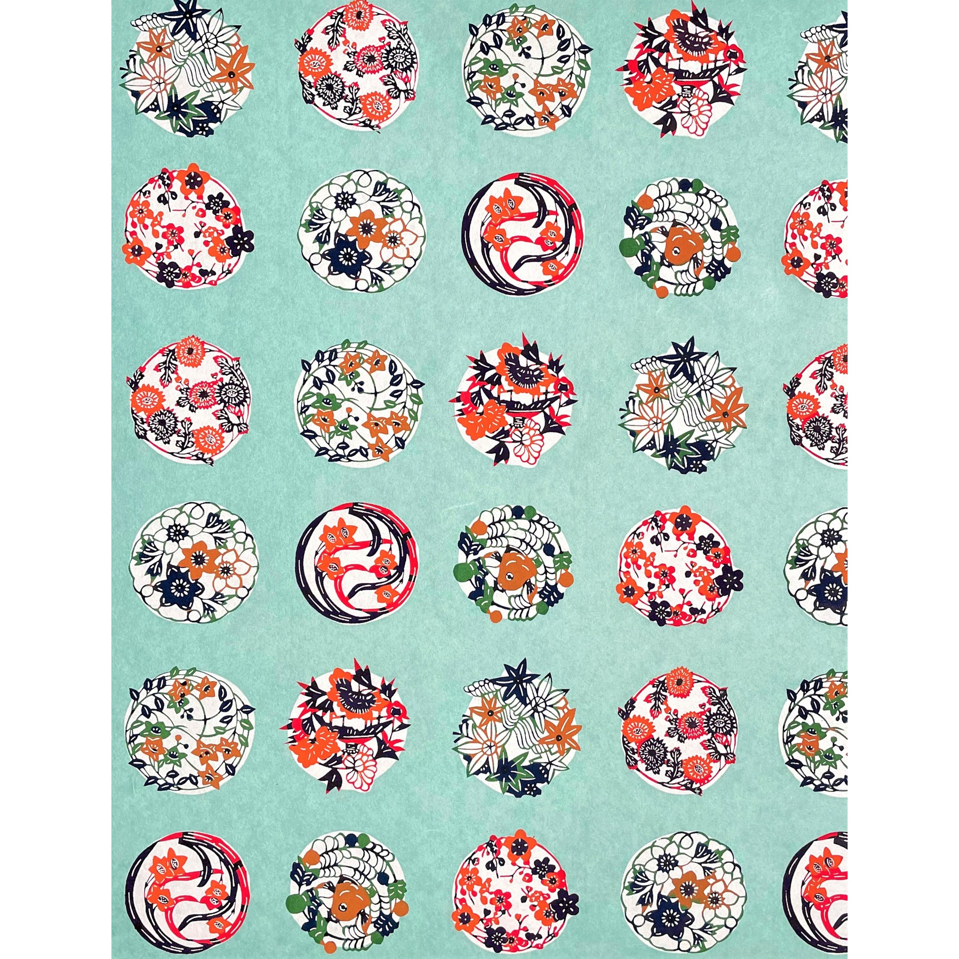 japanese stencil-dyed handmade paper with traditional botanical circles pattern on aqua backdrop, full sheet view
