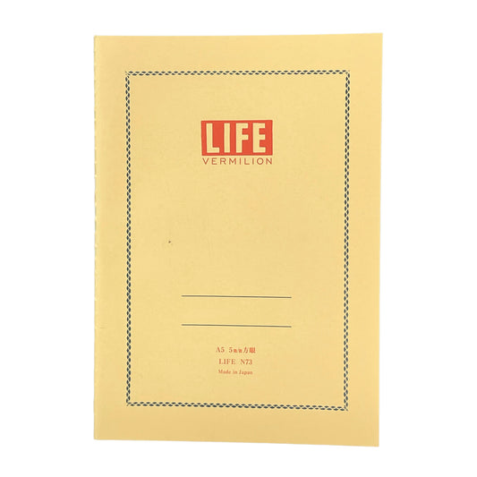 A5 softcover notebook with a soft yellow cover with blue border and branding by Japanese brand Life Japan