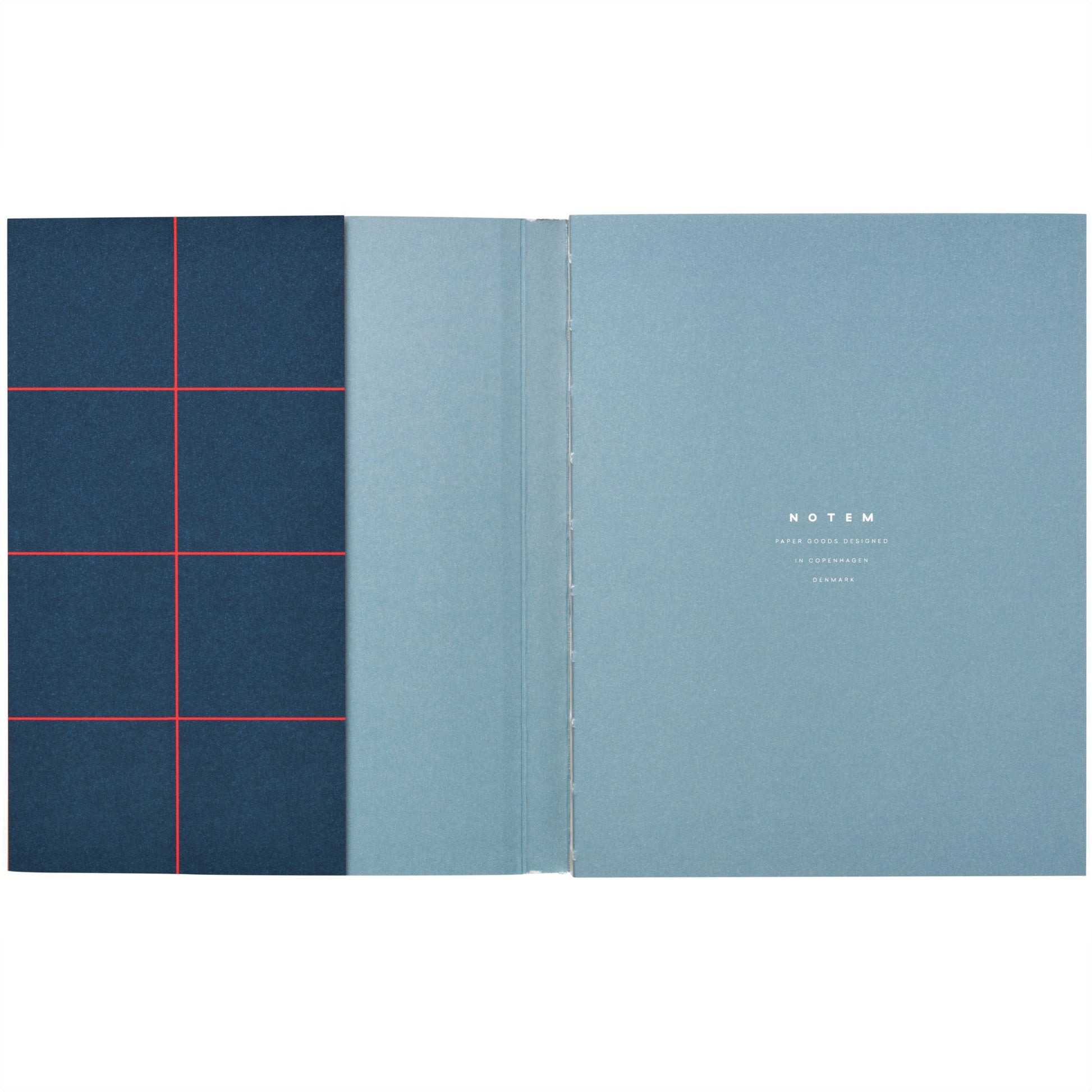 Layflat notebook with dark blue softcover with red grid lines, pictured open