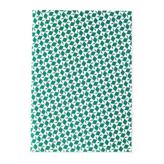 A5 softback notebook with geometric emerald green and white repeat diamond and triangles patterned cover. Dotted inner pages