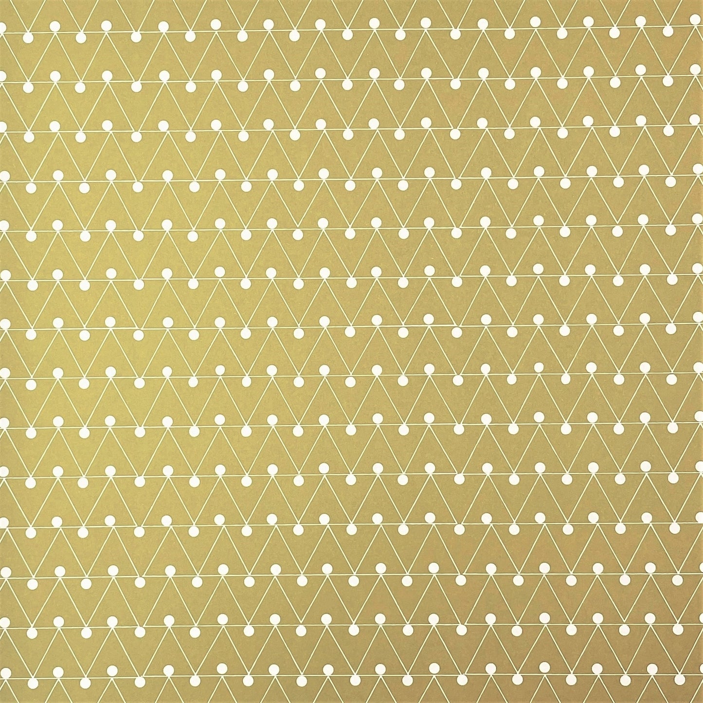 wrapping paper with abstract triangle and dot pattern in mustard and white by Ola Studio