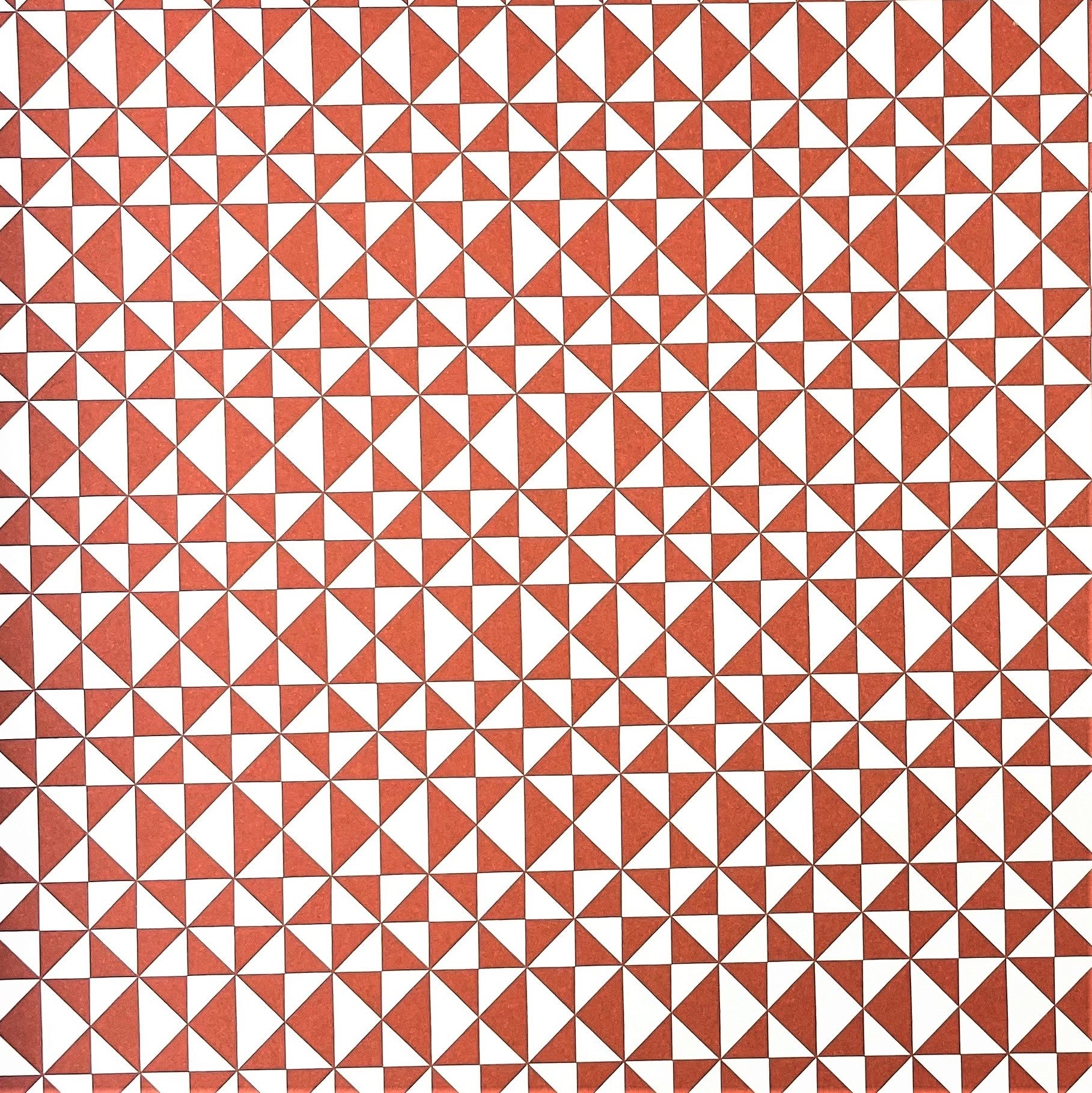 wrapping paper with an abstract triangle pattern in brick red and white by Ola Studio