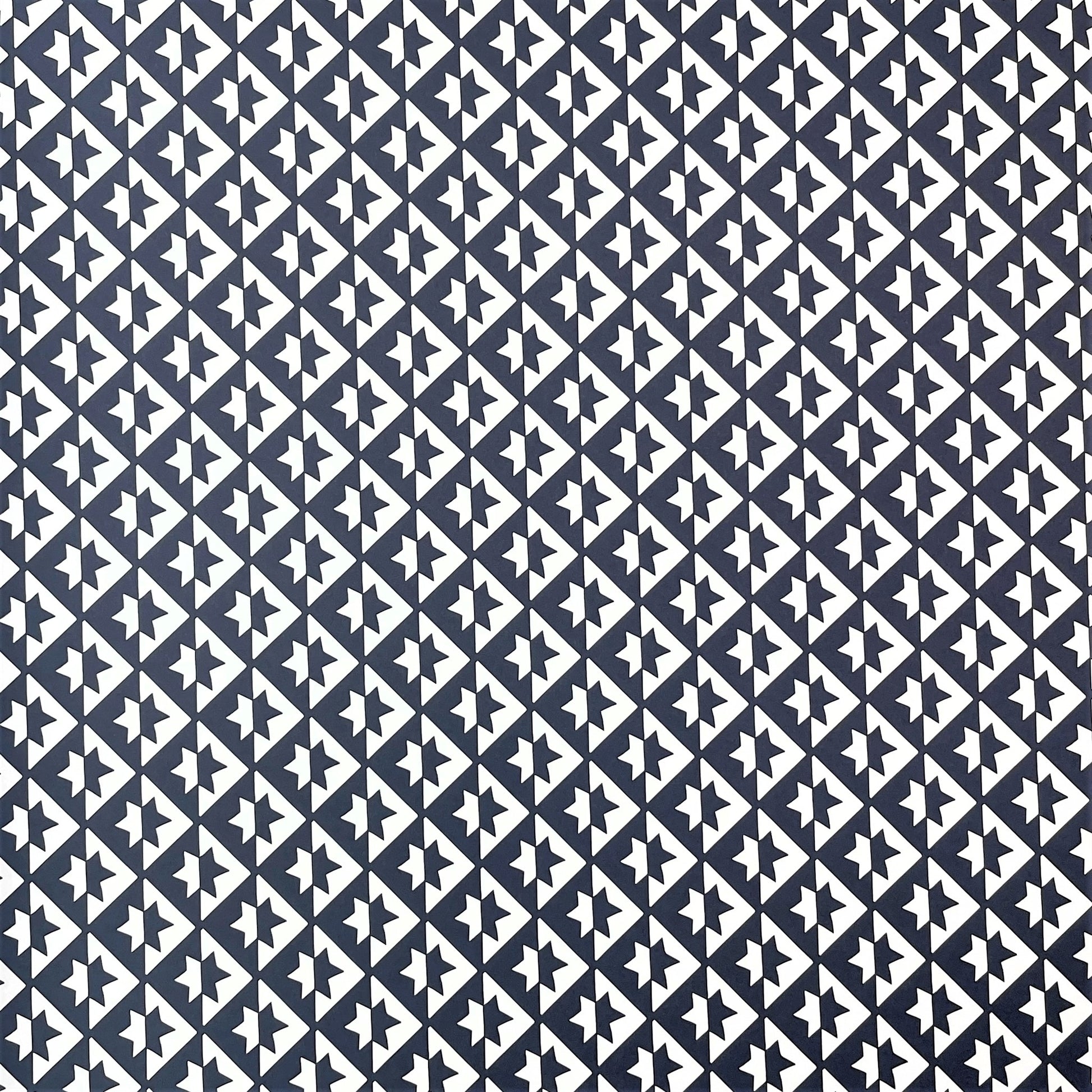 wrapping paper with an abstract star pattern in dark navy and white by Ola Studio