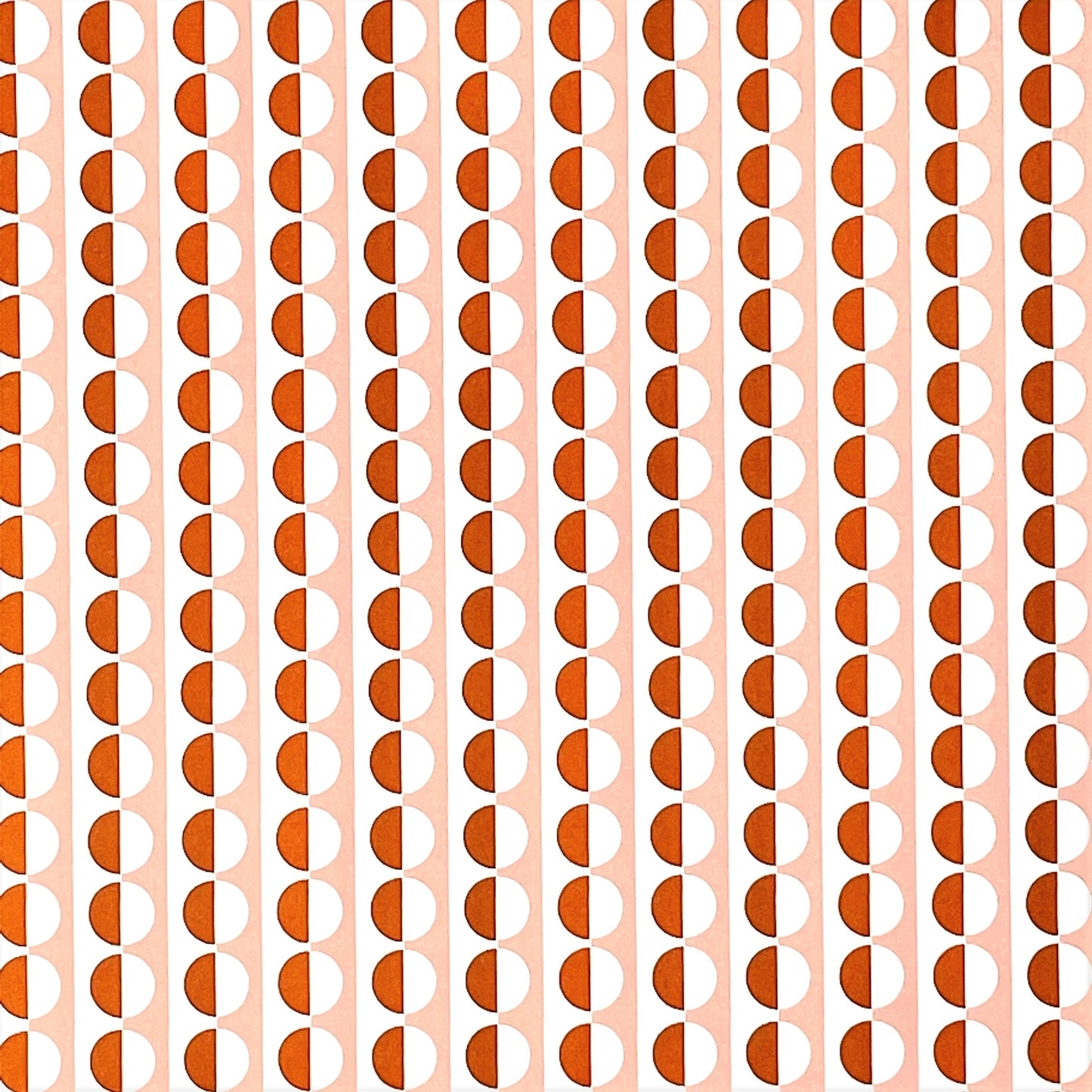 wrapping paper with an abstract circle pattern in orange and pale pink by Ola Studio