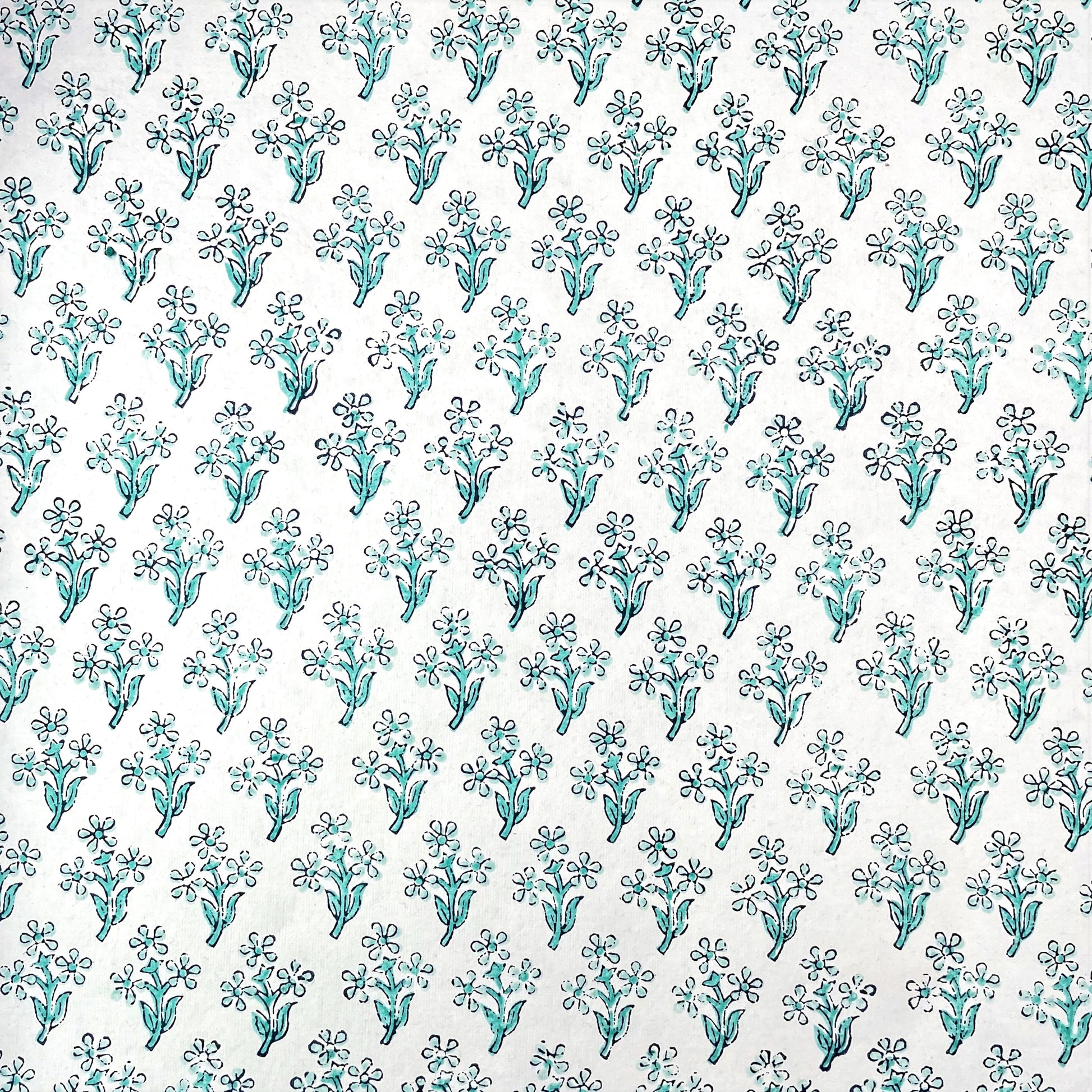 wrapping paper with repeat block print little floral pattern in aqua by Paper Mirchi