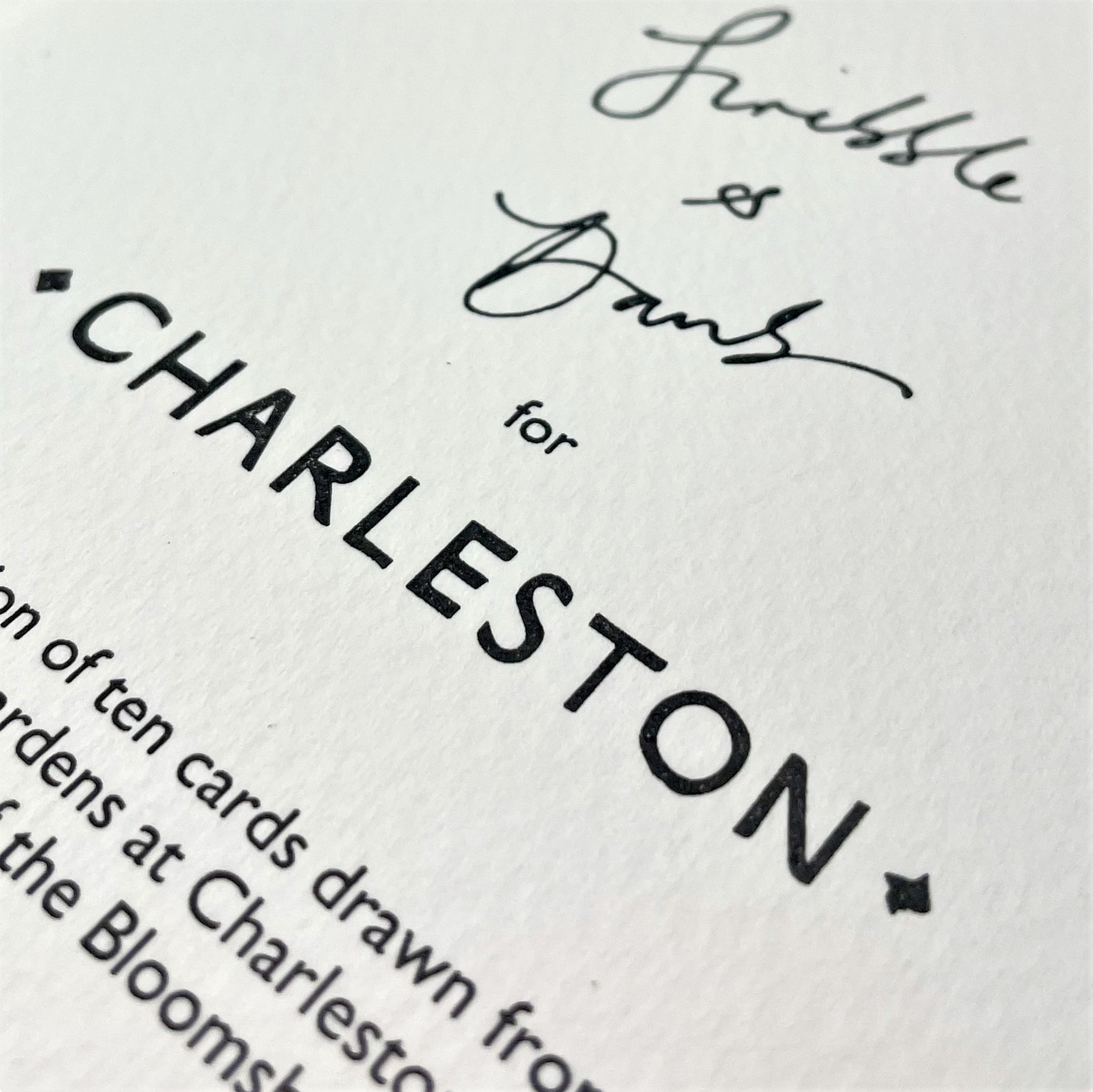 hand-painted greetings card of three flowers in yellow, orange and fuschia, text on reverse