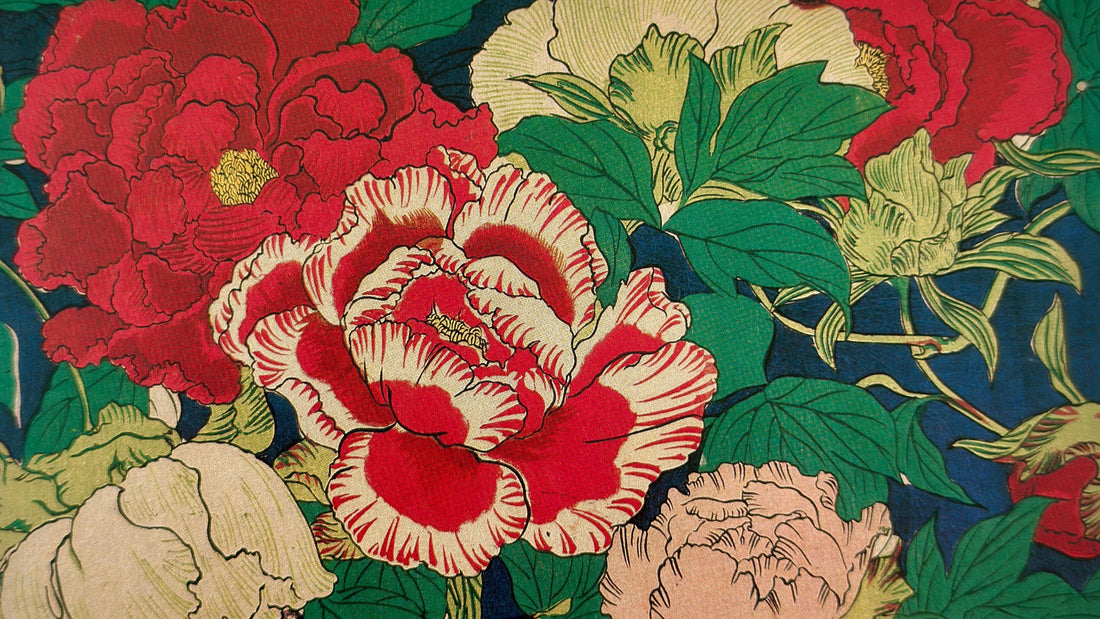 An image of a vintage sheet of chiyogami paper with a design of peonies on a dark blue ground.