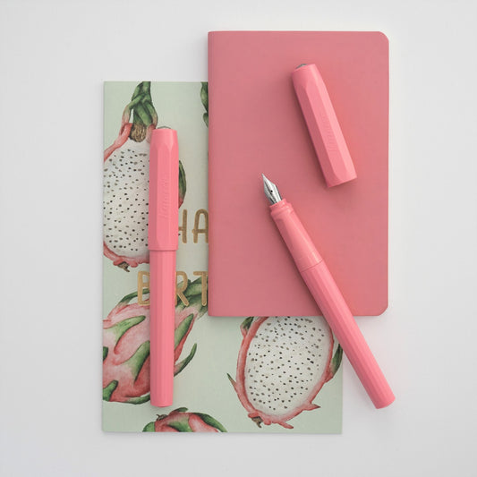 Image of a pink Perkeo fountain pen by Kaweco with a pink notebook