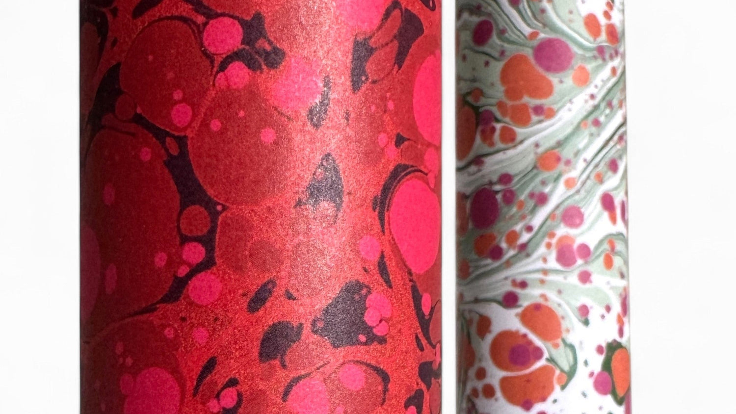 close up of a red and pink sheet of marbled paper
