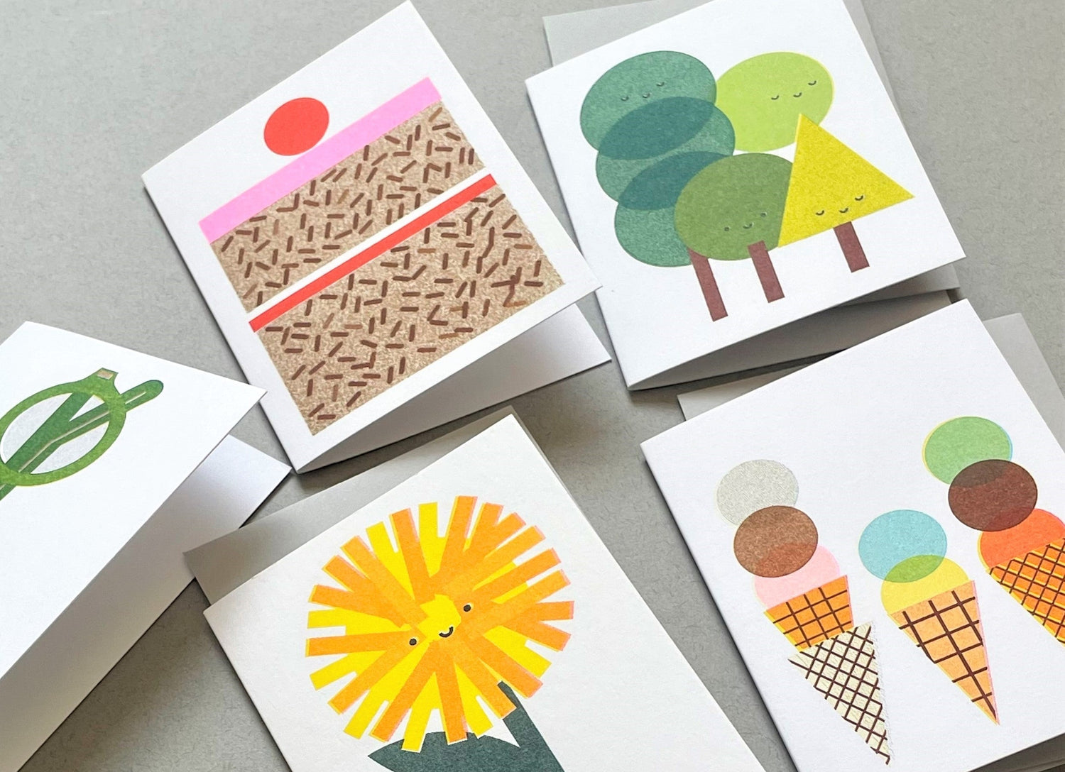 a selection of colourful greetings cards for children