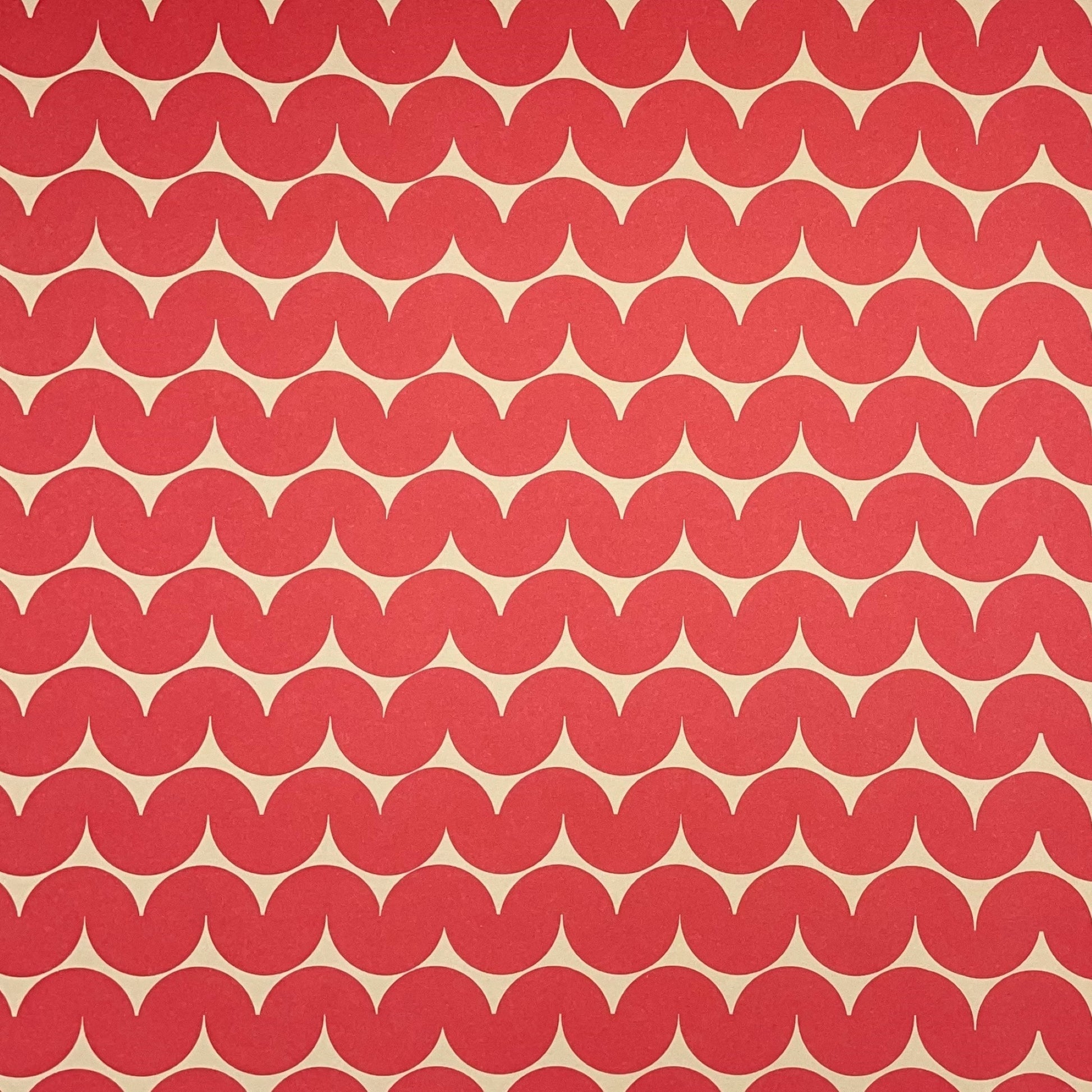 wrapping paper by Anne Davison Studio.  Bold red wiggle lines with a retro vibe on beige backdrop.