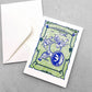 small greetings card with a bird and trumpet design in green and blue, by Archivist Gallery