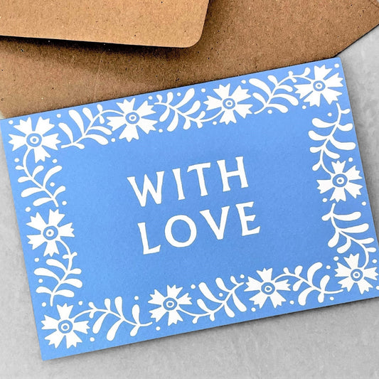 Greetings card with the words WITH LOVE, a white floral border on a blue background. Card by Ariana Martin