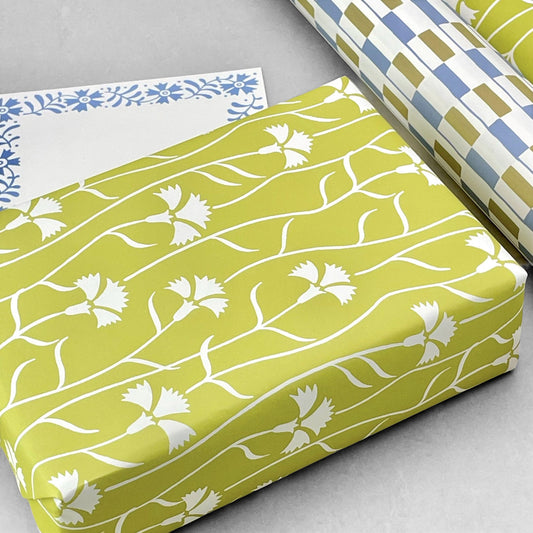 patterned paper, gift wrap with a white cornflower repeat pattern on soft lime green backdrop, by Ariana Martin
