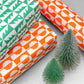 patterned paper, gift wrap, with all over pattern of green and white trees, by Ariana Martin